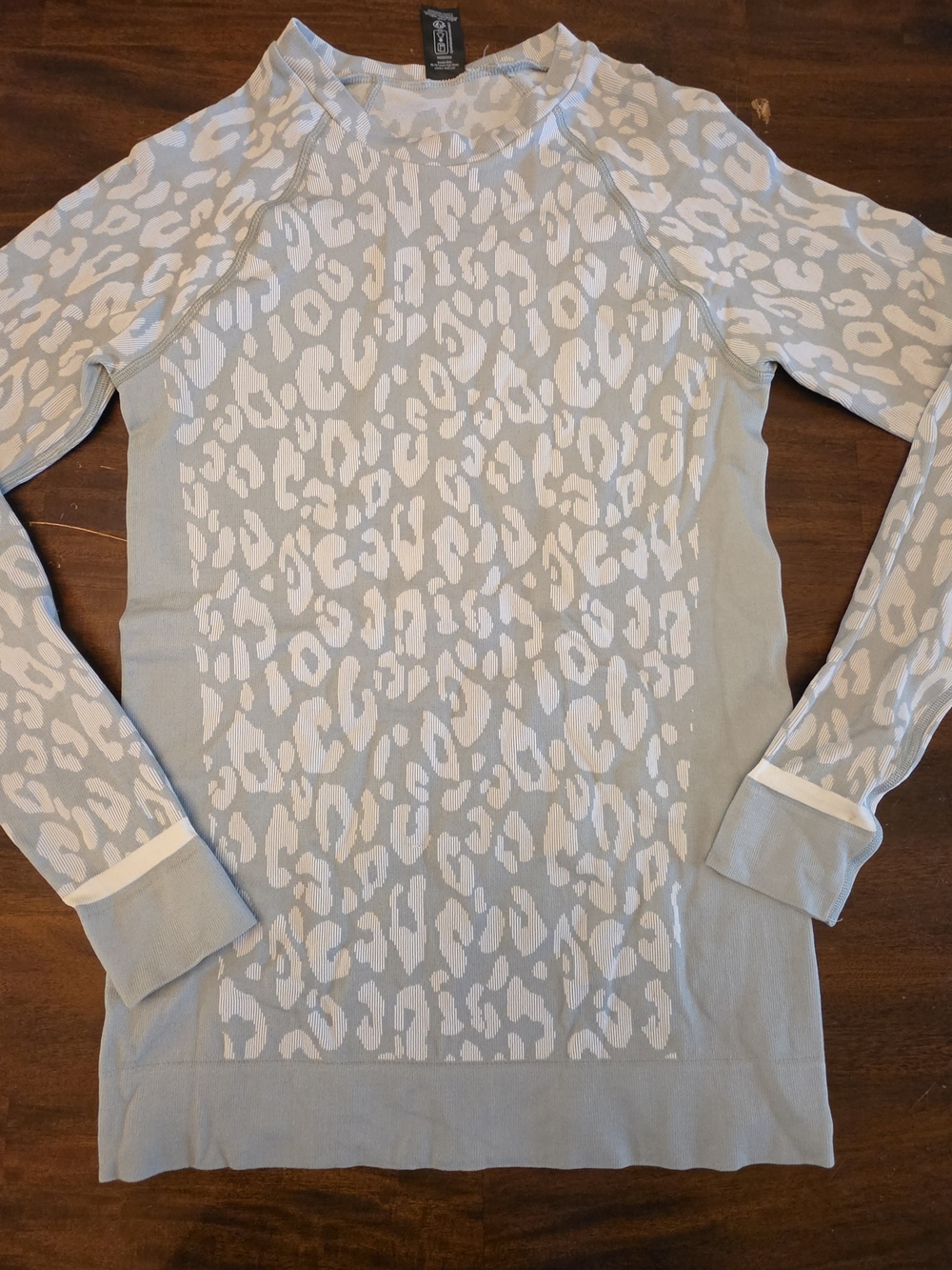 Sweaty Betty light blue and white leopard print pullover